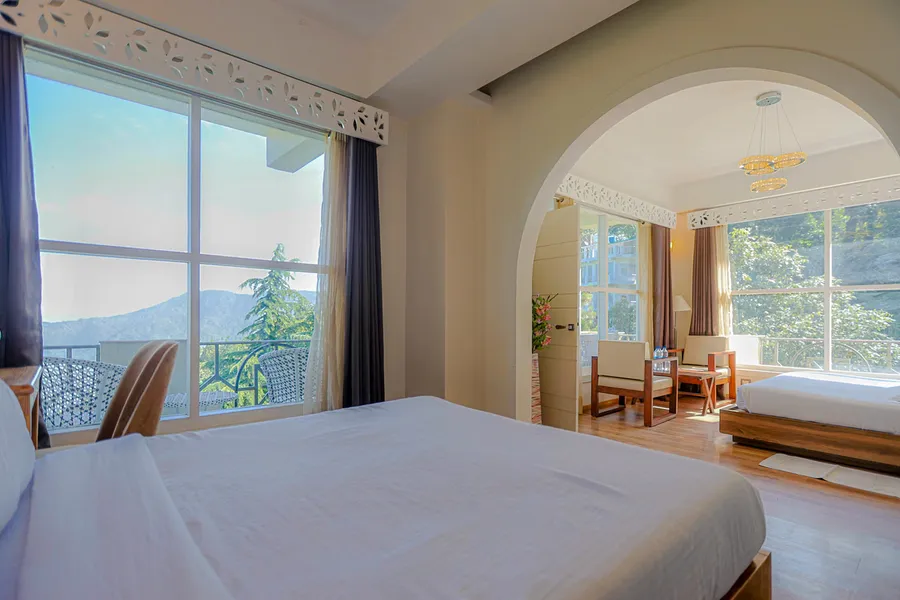 Deluxe Skylight Mountain Suite with glass ceiling and private balcony overlooking Himalayas