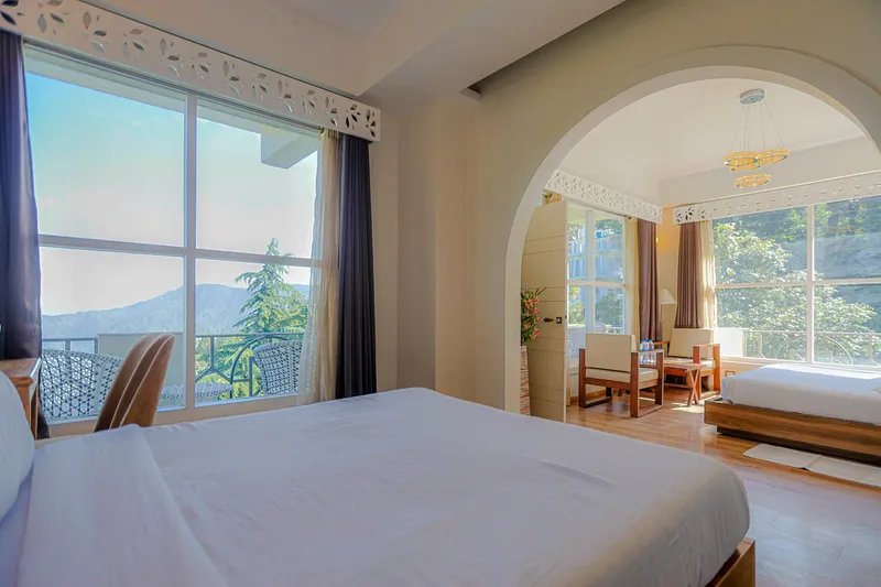 Cozy interior bedroom of Deluxe Skylight Suite — Solo Travellers & Couples' Retreat at Whispering Pines Resort Mukteshwar, Uttarakhand